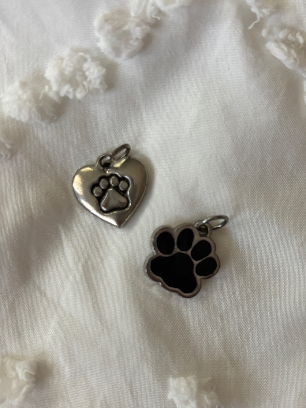2 small silver paw print charms